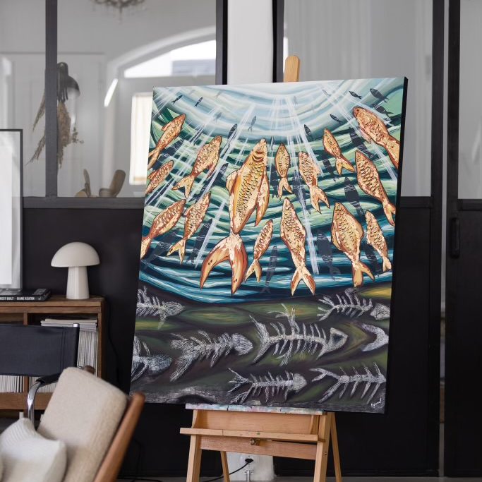 Artwork with golden fishes swimming into light and fishbones dead at the bottom